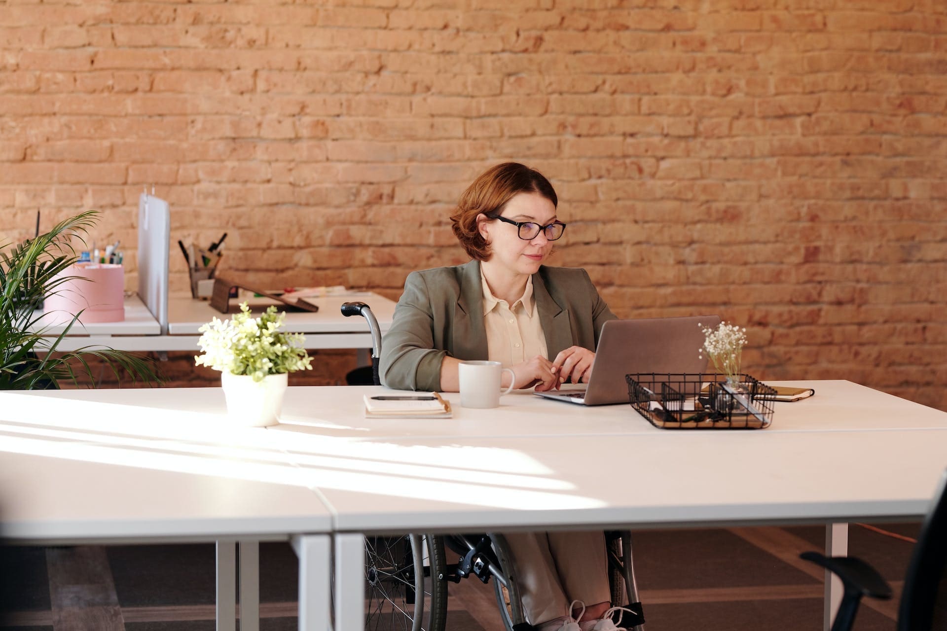 a woman using a laptop in the office